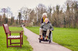 © Monkey Business - Senior Woman Pushing Senior Man In Wheelchair Outdoors In Fall Or Winter Park