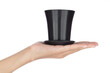 Hand holding Black Plastic Pot isolated on white background