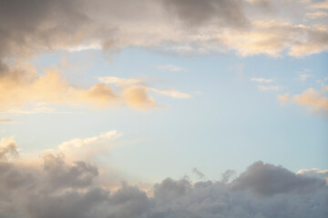 Wall Mural - clouds in the sky as a frame, sunset texture background.