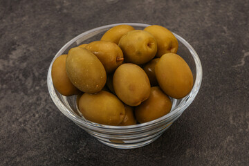 Green pickled olives in the bowl