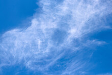 Whimsical Swirly Clouds In A Blue Sky
