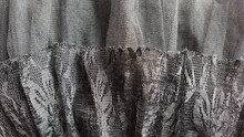 Black Lace On A Child's Skirt. Elements Of Elegant Clothes. Flounce Or Frill Around The Edge Of The Garment