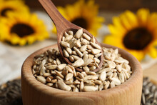Raw Peeled Sunflower Seeds In Wooden Bowl, Closeup