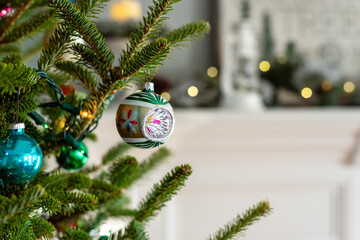 closeup of a vintage christmas ornament on a live tree