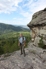 Man standing on the Ambarchiki rock, Belokurikha 2, Altai Mountains, Russia