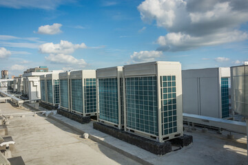 Poster - Central air conditioners condenser units at building rooftop