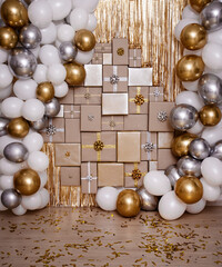 Christmas, new year or birthday background - wall decoration in golden and silver color with gifts and air balloons