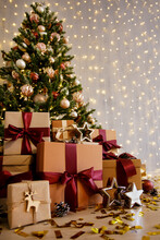 Decorated Christmas Tree And Gift Boxes With Stars And Confettti