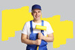 © Pixel-Shot - Mature male decorator near grey wall