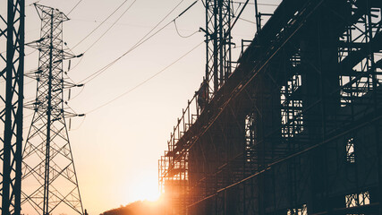 Wall Mural - Silhouette Engineer and construction team working at site over blurred  industry background with Light fair Film Grain effect.Create from multiple reference images together