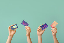 Female Hands With Credit Cards On Color Background
