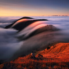 Wall Mural - autumn landscape, beautiful sunrise above the heavy clouds, mountain sea