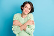 Photo of optimistic nice short hairdo girl hold herself wear lime sweater isolated on teal color background