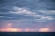 © Stefan - Rain clouds over the sea during sunset
