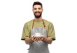© Syda Productions - people, profession and job concept - happy smiling waiter or barista in apron holding cup of coffee over white background