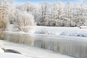 frozen snowy river banks scenery