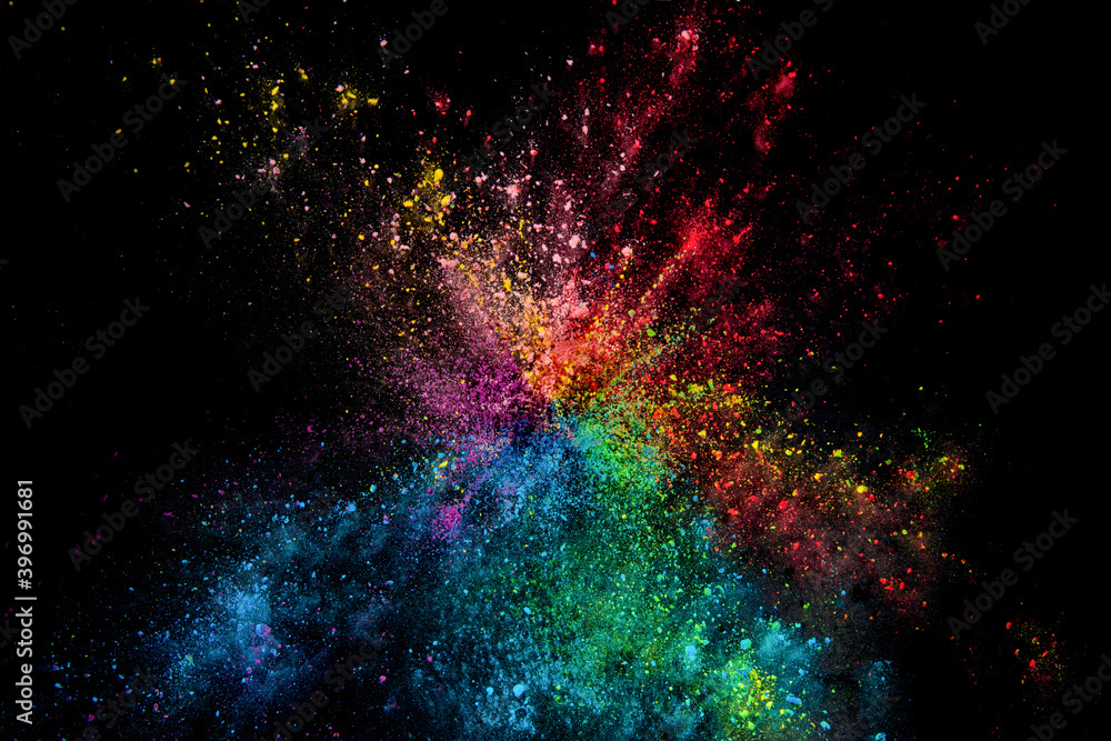 Explosion of colour powder isolated on black background. Abstract ...