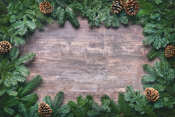 Wall Mural - christmas and new year background with fir branches on wooden board