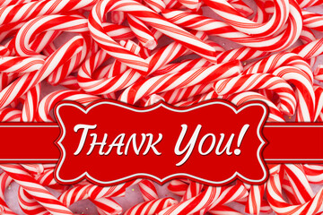 Wall Mural - Christmas Thank You message on a banner on a pile of candy canes