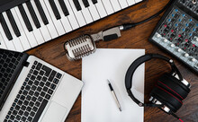 Music Studio Equipment And White Paper With Pen. Songwriting Concept.