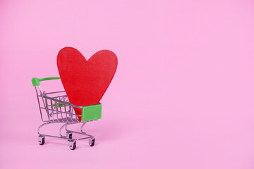 Wall Mural - Shopping cart with red heart