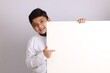 © Ojas - Young Indian schoolboy showing blank copy space.