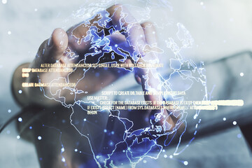 abstract creative coding concept with world map and finger clicks on a digital tablet on background.