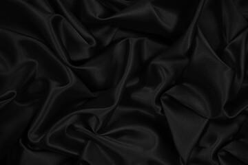 Wall Mural - Black silk satin. Black elegant shiny fabric background. Beautiful abstract background.