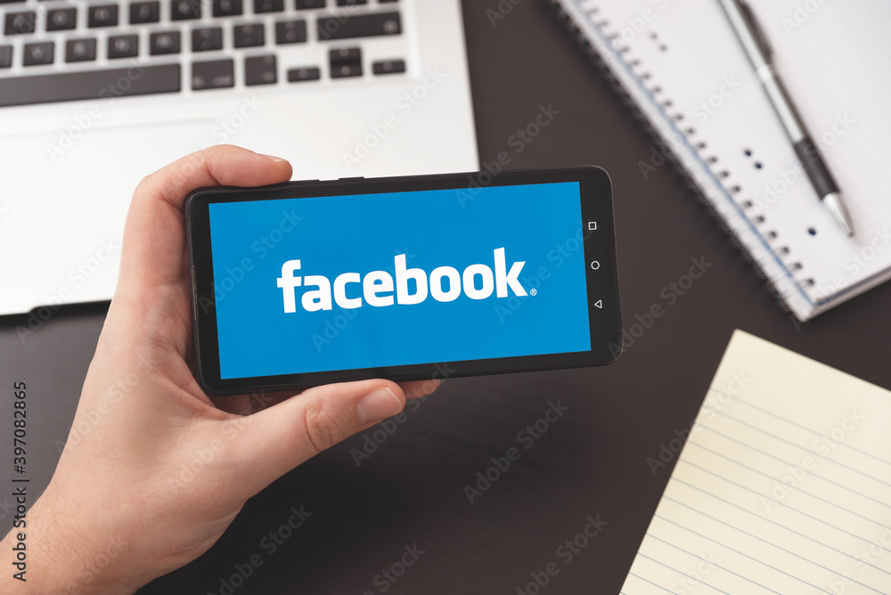 Facebook logo on smartphone. Social media Stock Photo | Adobe Stock