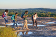 © Mhandy/Creative Flame - Diverse group of friends hiking Arabia Mountain in USA