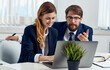 © SHOTPRIME STUDIO - Business man and woman in suit with laptop and flower potted office staff communication