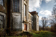 Old abandoned palace, manor in the autumn forest.