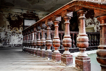 Old wooden railing of a vintage staircase.