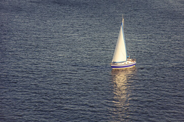 lonely yacht sailing in the ocean