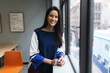 © Wavebreak Media - Portrait of mixed race woman by window in creative office