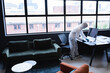 © Wavebreak Media - Health worker in protective clothing disinfecting creative office