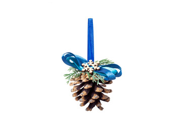 pine cone toy eco friendly decoration for a Christmas tree with a ribbon bow, decor object hanging gift for the New Year holidays isolated on a white background with copy space, nobody.