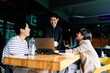 © THESHOTS.CO - Group of asian business people planning project at cafe.