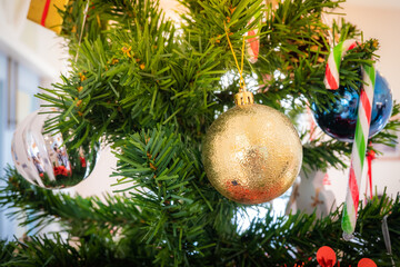 Christmas tree decorated with balls and gift boxes with snowmen to celebrate the festival. Copy space background