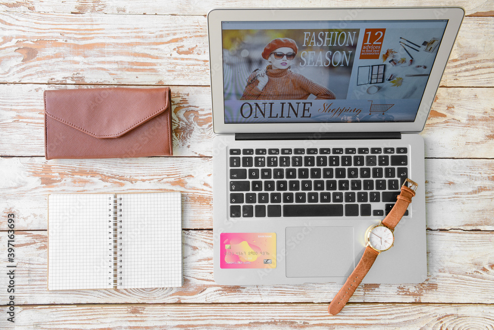 Composition with laptop computer on wooden background. Online shopping concept