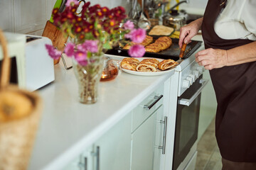 Wall Mural - Senior woman placing piece of pie on plate