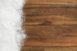 © New Africa - Artificial snow on wooden background, top view with space for text. Christmas decor