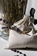 aromatherapy and organic concept - close up of craft sachet bag and dried lavender flowers