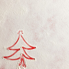 Wall Mural - Christmas tree on flour background. White flour looks like snow. Top view