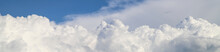 White Thick Clouds And Blue Sky Banner. Sunny Day Background