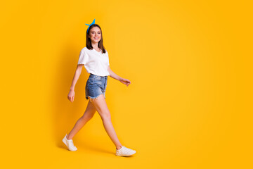 Poster - Full length profile side photo of charming brown haired girl happy walk wear blue pin-up isolated on bright color background