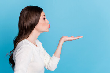 Canvas Print - Photo of shiny flirty wavy lady wear white sweater looking empty space sending kiss isolated blue color background