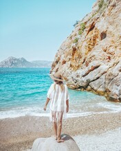 Woman At Ficajola Beach In Corsica, France. 