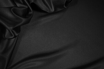  Black silk satin fabric background with copy space for your product or text.  Black elegant background
