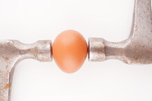 Metal Hammer And Egg On White Background